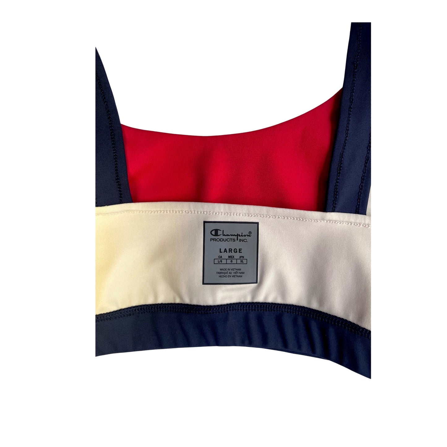 Top deportivo Champion color block rojo, beige y azul